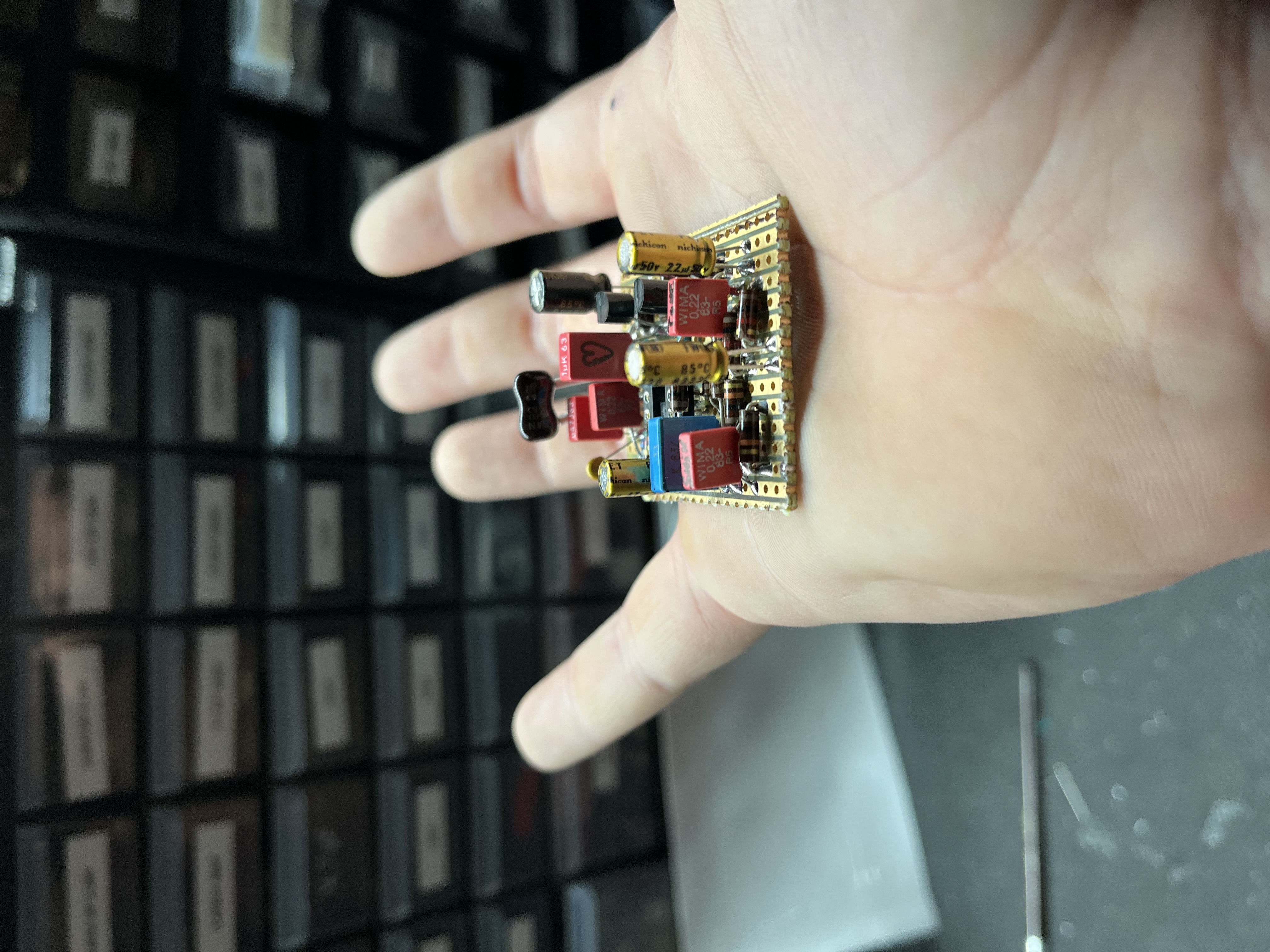 Point-to-point wired board held in hand, component drawers behind